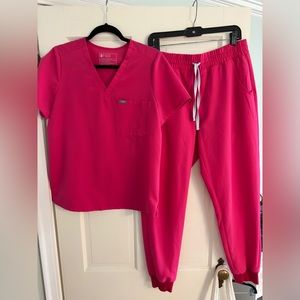 Size medium figs scrub set in hot pink. Bottoms are high waisted! Worn once